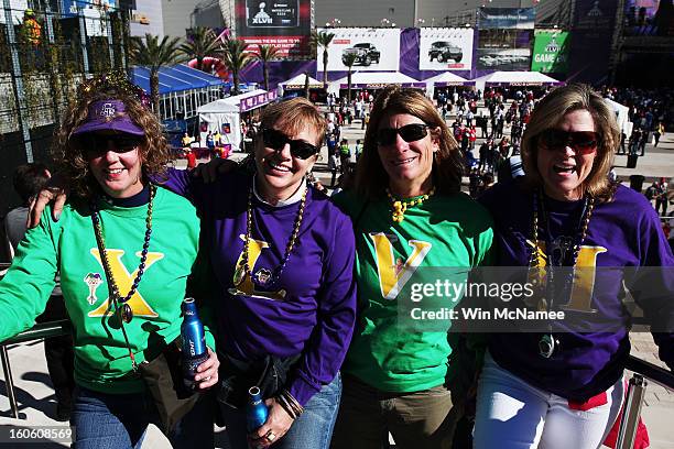 Sue Weber, Tracy Heaberlin, Jan Levy and Danielle Gallagher, fans of the Baltimore Ravens, show support for their team outside the stadium prior to...