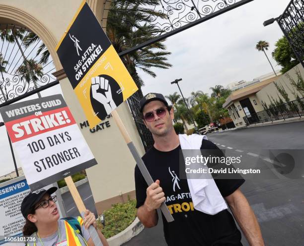 Ethan Peck walks the picket line at Paramount Studios on August 10, 2023 in Los Angeles, California. Members of SAG-AFTRA and WGA have both walked...