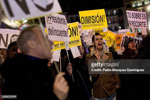 Protestors shout slogans during a demonstration against alleged corruption scandals implicating the PP , on the streets of Madrid on February 3, 2013...