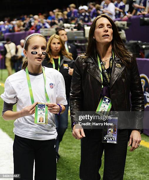 Alison Harbaugh and Ingrid Harbaugh, daughter and wife of Baltimore Ravens head coach John Harbaugh stand on the field prior to Super Bowl XLVII...