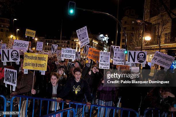 Protestors shout slogans during a demonstration against alleged corruption scandals implicating the PP , on the streets of Madrid on February 3, 2013...