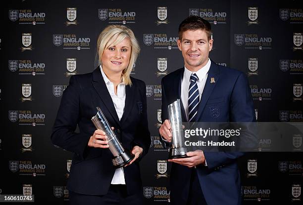 In this handout image provided by The FA, Stephanie Houghton poses with the Senior Women's Player of the Year award and Steven Gerrard poses with the...