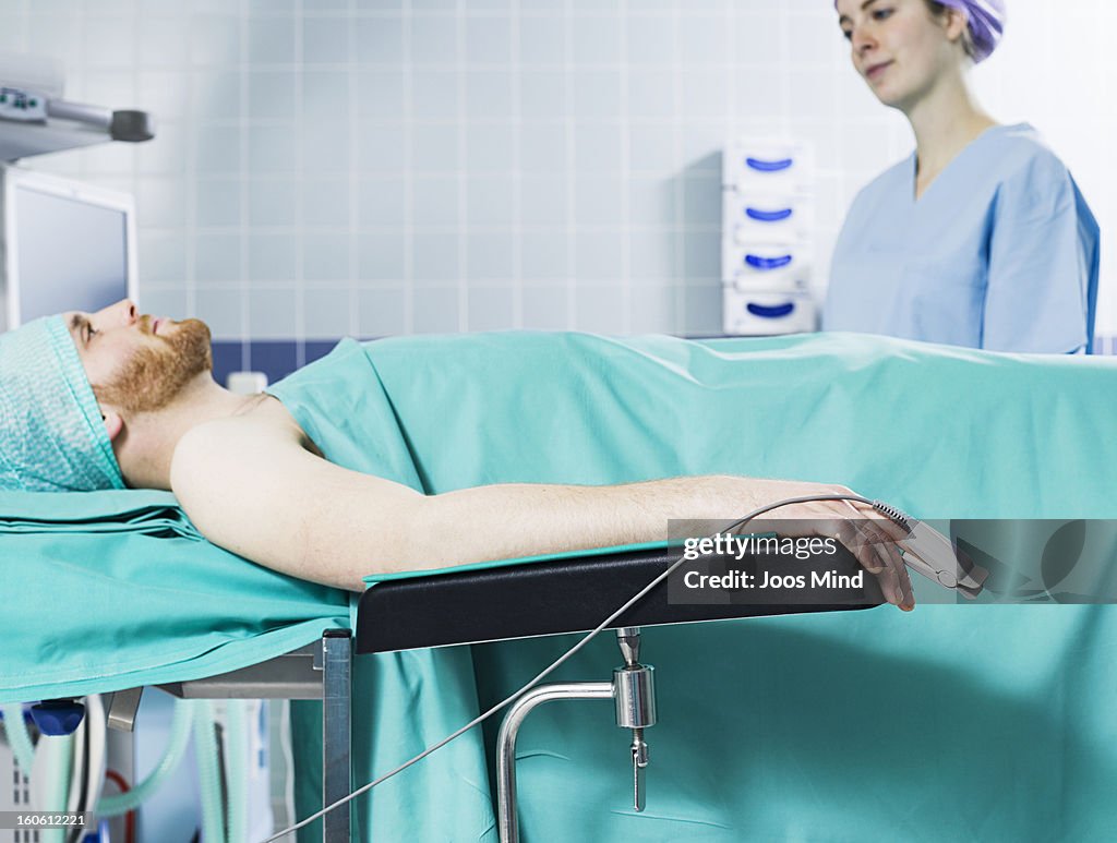 Female anaesthetist watching patient
