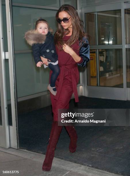 Victoria Beckham and daughter, Harper Beckham land at John F. Kennedy Airport on February 3, 2013 in New York City.