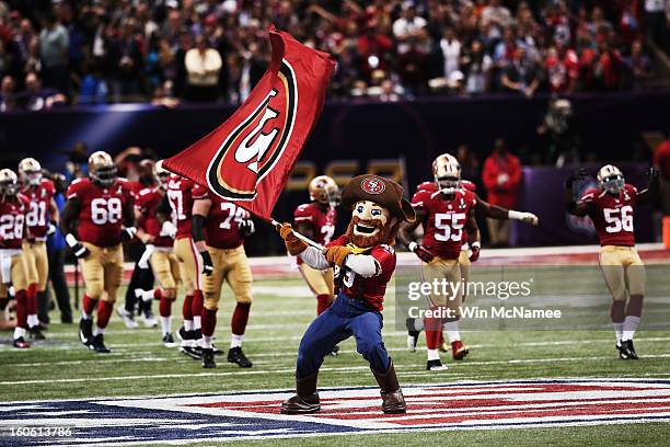 San Francisco 49ers mascot Sourdough Sam waves a flag on the field as players take the field against the Baltimore Ravens during Super Bowl XLVII at...