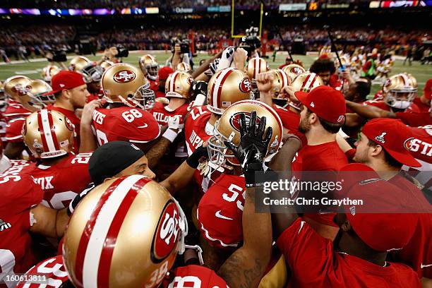 The San Francisco 49ers huddle up prior to the start of Super Bowl XLVII against the Baltimore Ravens at the Mercedes-Benz Superdome on February 3,...