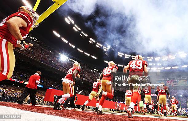 The San Francisco 49ers take the field against the Baltimore Ravens during Super Bowl XLVII at the Mercedes-Benz Superdome on February 3, 2013 in New...
