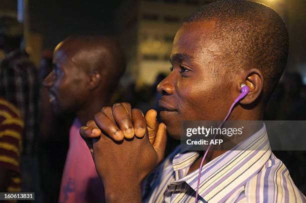 Supporter of the Togo football team reacts as he watches on TV the African Cup of Nation 2013 quarter final football match between Burkina Faso and...