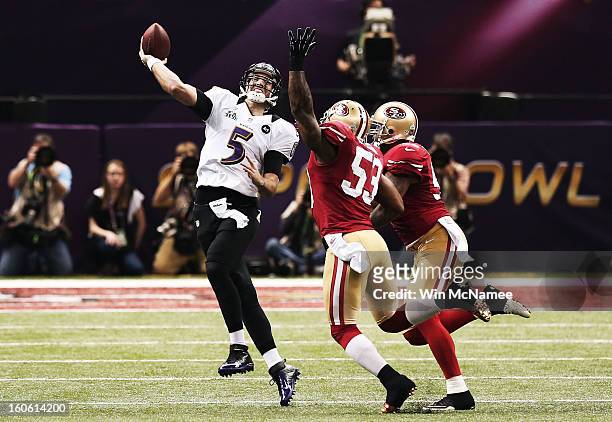 Joe Flacco of the Baltimore Ravens throws a 30-yard reception in the first quaretr to Anquan Boldin against NaVorro Bowman of the San Francisco 49ers...