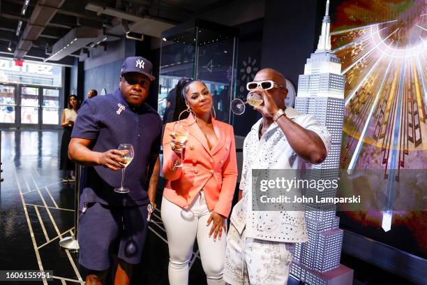 Jadakiss, Ashanti and Ja Rule pose as Jadakiss, Ja Rule and Ashanti Light Up the Empire State Building in Celebration of the 50th Anniversary of...