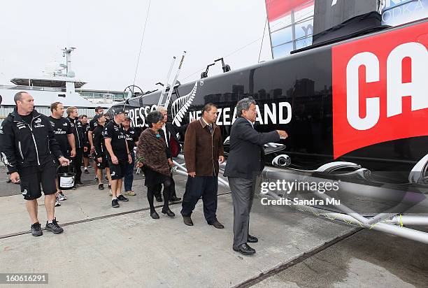 The Team New Zealand crew follow Matt Maihi, Kaumatua of Ngati Whatua Orakei as he blesses the boat during the launch of the Emirates Team New...