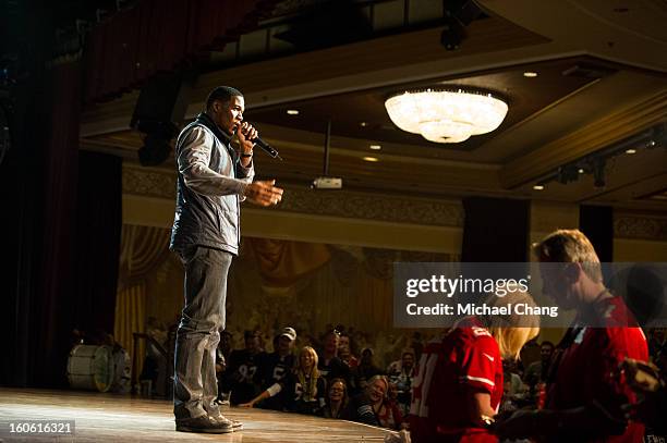 Michael Strahan answers questions from the audience during the Ultimate Super Bowl Tailgate Party hosted by Michael Strahan at Harrah's Casino on...