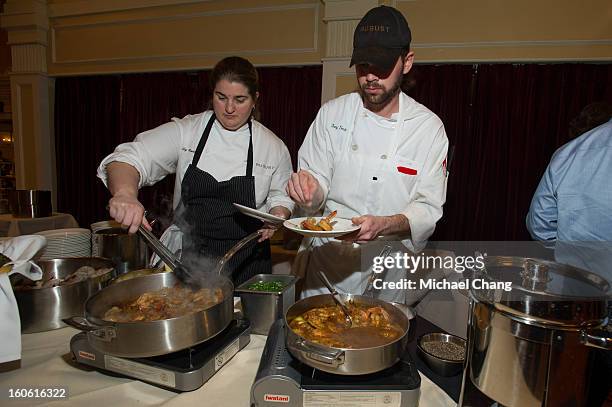 Staff serve attendees during the Ultimate Super Bowl Tailgate Party hosted by Michael Strahan at Harrah's Casino on February 3, 2013 in New Orleans,...