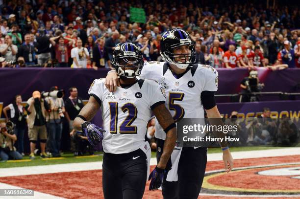 Jacoby Jones and Joe Flacco of the Baltimore Ravens celebrate after Jones caught a 56-yard touchdown pass from Flacco in the second quarter against...