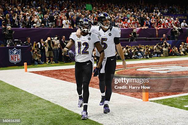 Jacoby Jones and Joe Flacco of the Baltimore Ravens celebrate after Jones caught a 56-yard touchdown pass from Flacco in the second quarter against...