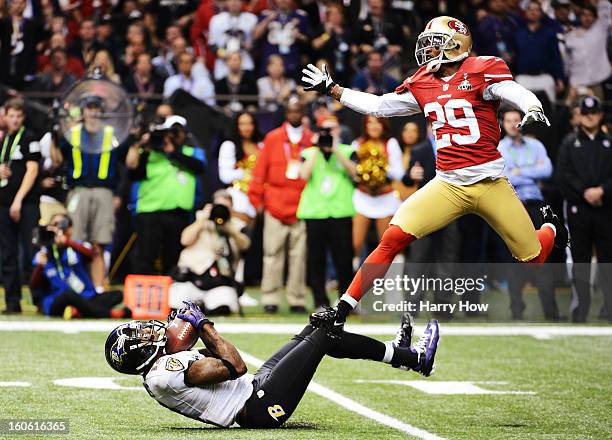 Jacoby Jones of the Baltimore Ravens catches a 56-yard touchdown reception in the second quarter against Chris Culliver of the San Francisco 49ers...