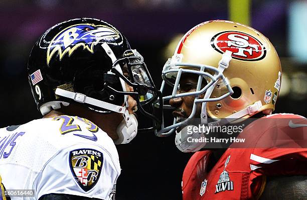 Cary Williams of the Baltimore Ravens and Delanie Walker of the San Francisco 49ers exchange words in the second quarter during Super Bowl XLVII at...