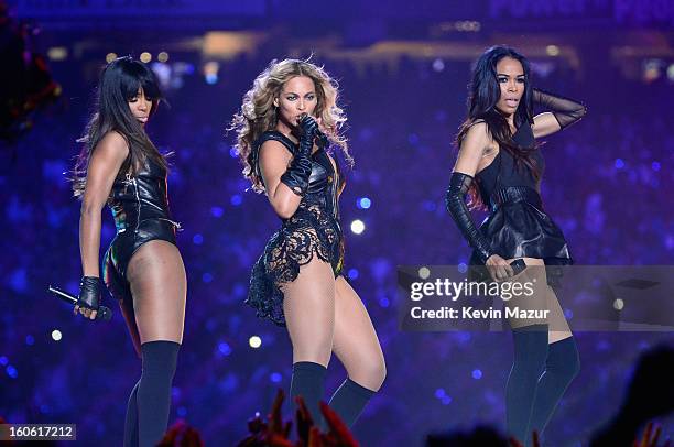 Singers Kelly Rowland, Beyonce and Michelle Williams of Destiny's Child perform during the Pepsi Super Bowl XLVII Halftime Show at Mercedes-Benz...