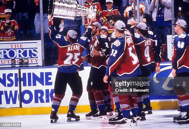 Mike Keane of the Colorado Avalanche skates on the ice with the Stanley Cup after the Avalanche defeated the Florida Panthers in Game 4 of the 1996...