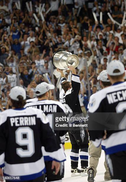 Pavel Kubina of the Tampa Bay Lightning skates with the Stanley Cup after defeating the Calgary Flames in Game 7 of the NHL Stanley Cup Finals on...