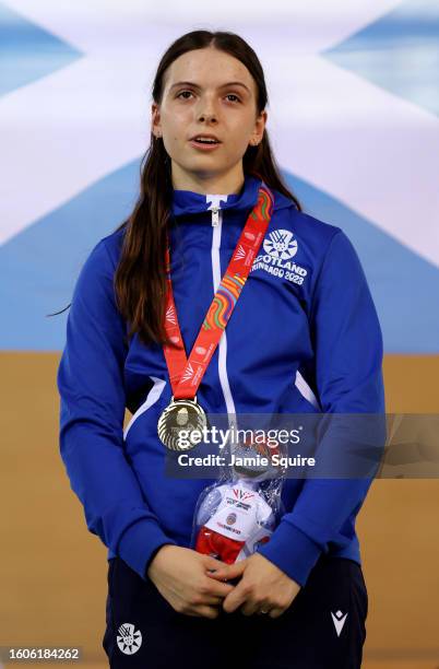 Gold Medallist, Sarah Johnson of Team Scotland stands on the podium during the Women's Keirin medal ceremony on day six of the 2023 Youth...