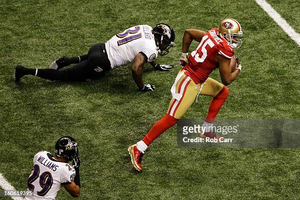 Michael Crabtree of the San Francisco 49ers runs into the endzone on a 31-yard touchdown reception in the third quarter against Bernard Pollard of...