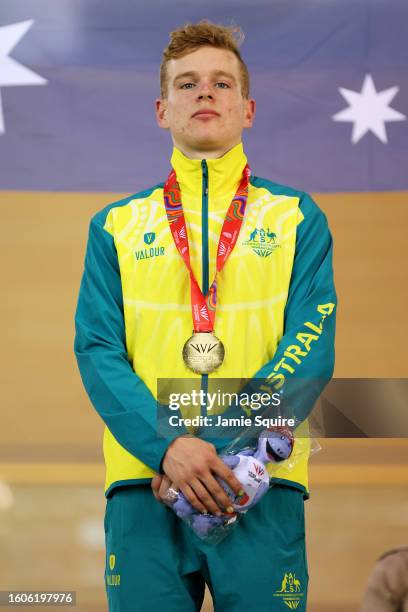 Gold Medallist, Samuel McKee of Team Australia stands on the podium during the Men's 10km Scratch Race medal ceremony on day six of the 2023 Youth...