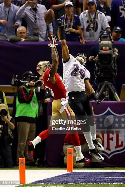 Cary Williams of the Baltimore Ravens breaks up a pass in front of Ted Ginn of the San Francisco 49ers in the third quarter during Super Bowl XLVII...