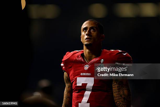 Colin Kaepernick of the San Francisco 49ers looks up during a power outage that occurred in the third quarter that caused a 34-minute delay during...