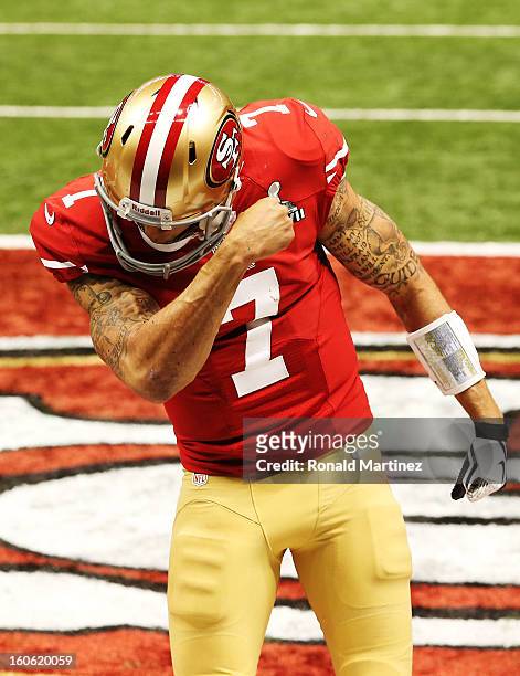 Colin Kaepernick of the San Francisco 49ers reacts after he scored a 15-yard rushing touchdown in the fourth quarter against the Baltimore Ravens...