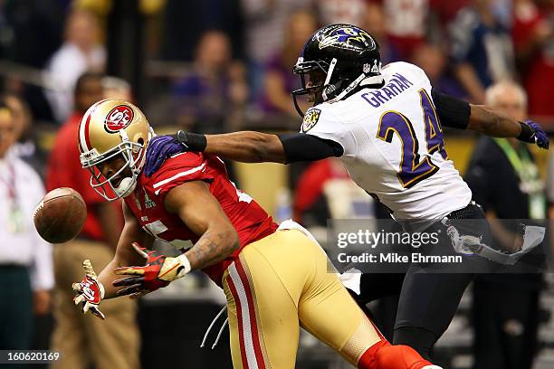 Michael Crabtree of the San Francisco 49ers fails to make a catch against Corey Graham of the Baltimore Ravens during Super Bowl XLVII at the...