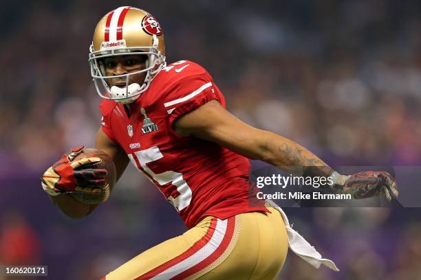 Michael Crabtree of the San Francisco 49ers runs in for a touchdown in the second half against the Baltimore Ravens during Super Bowl XLVII at the...