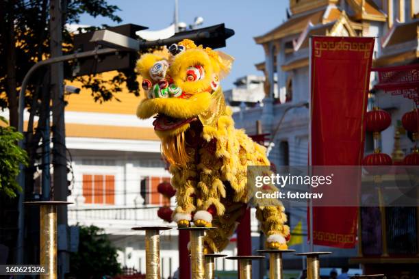 chinese dragon dance at chinese new year - lion dancing stock pictures, royalty-free photos & images