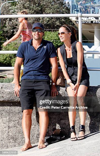 Former Australian tennis player Pat Rafter with his wife Lara Rafter at Bondi Beach on January 17, 2010 in Sydney, Australia.