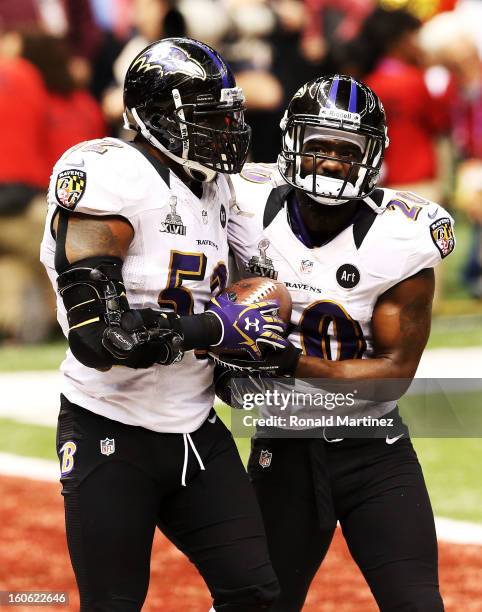 Ray Lewis and Ed Reed of the Baltimore Ravens react after the San Francisco 49ers couldn't convert on a fourth down play in the final two minutes of...