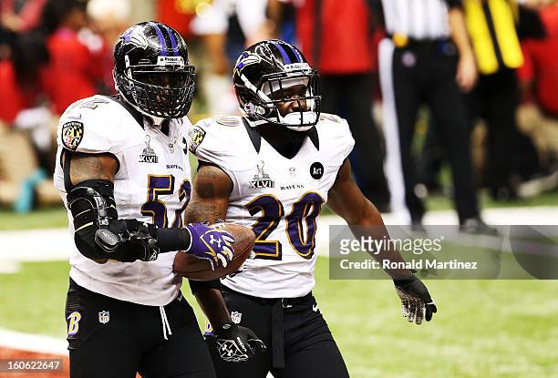 Ray Lewis and Ed Reed of the Baltimore Ravens react after the San Francisco 49ers couldn't convert on a fourth down play in the final two minutes of...