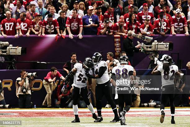 Ray Lewis and Michael Oher of the Baltimore Ravens celebrate after the San Francisco 49ers couldn't convert a fourth down play to turn the ball over...