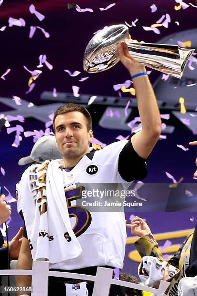 Joe Flacco of the Baltimore Ravens holds up the Vince Lombardi Trophy following their 34-31 win against the Baltimore Ravens during Super Bowl XLVII...