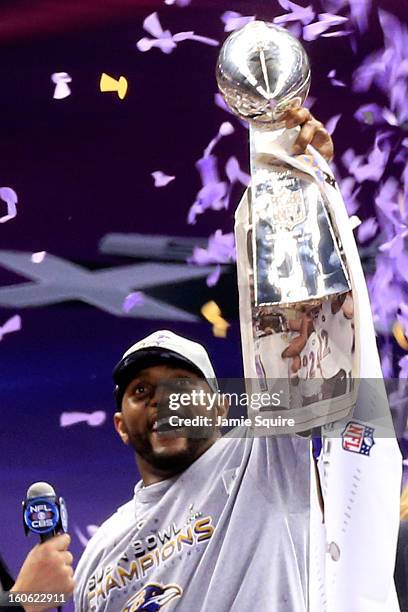 Ray Lewis of the Baltimore Ravens holds up the Vince Lombardi Trophy following their 34-31 win against the San Francisco 49ers during Super Bowl...