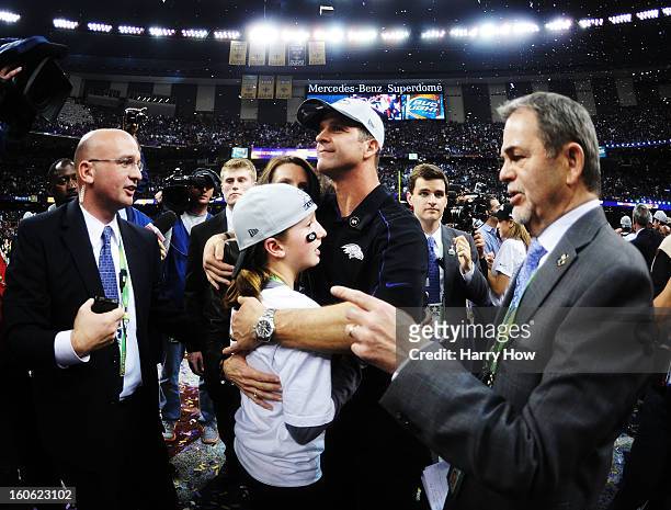 Head coach John Harbaugh of the Baltimore Ravens hugs his daughter Alison and wife Ingrid after the Ravens won 34-31 against the San Francisco 49ers...