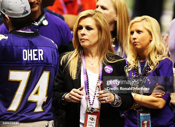 Leigh Anne Tuohy celebrates on the field after her adoptive son Michael Oher of the Baltimore Ravens and the Ravens defeat the San Francisco 49ers...