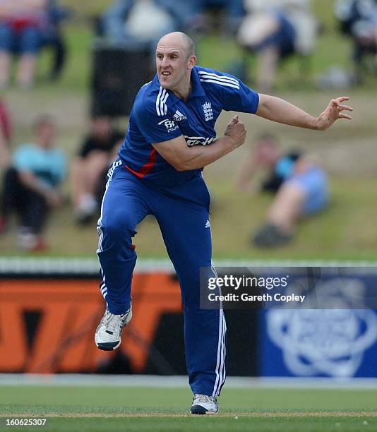 James Tredwell of England bowls during a T20 Practice Match between New Zealand XI and England at Cobham Oval on February 4, 2013 in Whangarei, New...