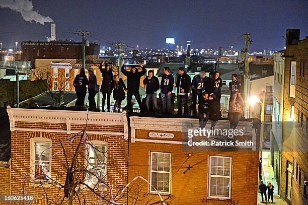 Baltimore Ravens celebrate in the streets after Super Bowl XLVII against the San Francisco 49ers in the neighborhood of Federal Hill on February 3,...