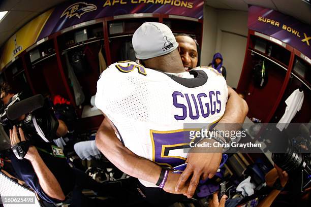 Ray Lewis of the Baltimore Ravens hugs teammate Terrell Suggs in the locker room following their 34-31 win against the San Francisco 49ers during...