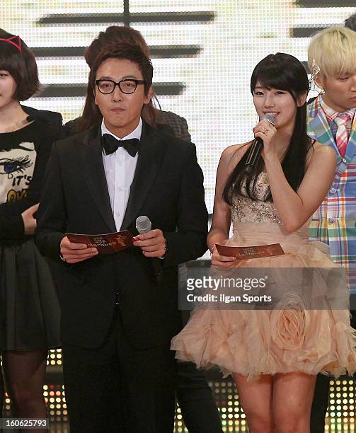 Host Tak Jae-Hoon and Su-Zy of Miss A speak onstage during the 22nd High 1 Seoul Music Awards at Olympic Park on January 31, 2013 in Seoul, South...