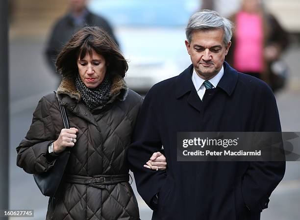 Former Cabinet Minister Chris Huhne arrives at Southwark Crown Court with Carina Trimingham on February 4, 2013 in London, England. Huhne and his...