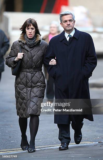 Former Cabinet Minister Chris Huhne arrives at Southwark Crown Court with Carina Trimingham on February 4, 2013 in London, England. Huhne and his...