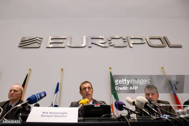 Europol's chief Rob Wainwright speaks next to Friedhelm Althans, chief investigator of Bochum police and Andreas Bachmann from the Bochum prosecution...