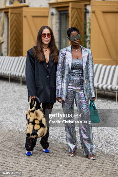 Idalia Salsamendi wears oversized blazer, animal print bag, laced pants outside Munthe during the Copenhagen Fashion Week Spring/Summer 2024 on...