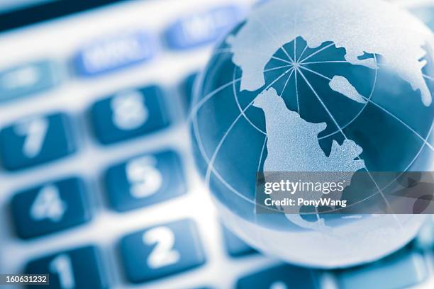 globe on calculator, america map - world bank stockfoto's en -beelden